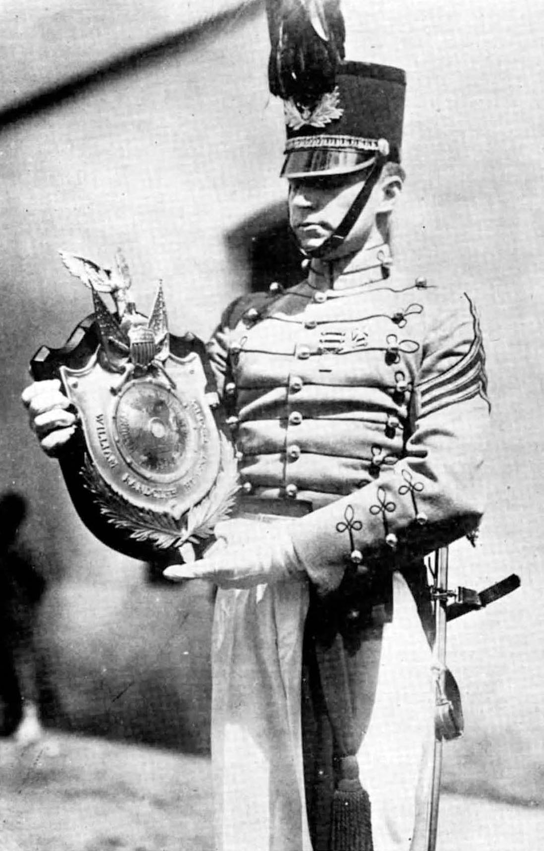 Walter Fetterly holding a rifle trophu