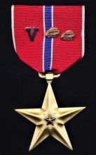 bronze star medal with v and two oak leaves military award
