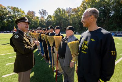 Lt. Col. James Pascoe inspects brooms during the broom drill.