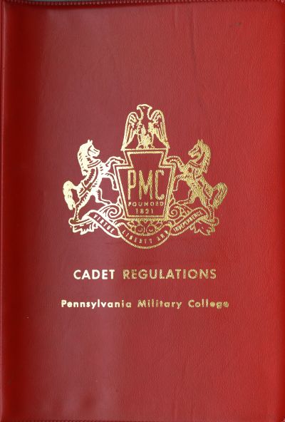 PMC's red Cadet Regulations binder.